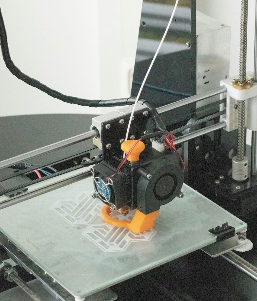 Advanced 3D printer used for precise dental implant treatment planning at North Carolina Implants and Periodontics in Raleigh.