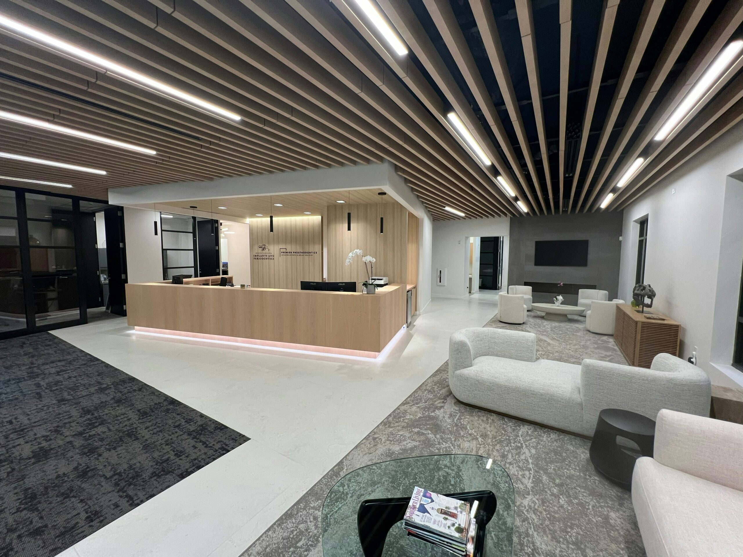 Modern and welcoming lobby of North Carolina Implants and Periodontics in Raleigh, where patients receive All-on-4 dental implant consultations.